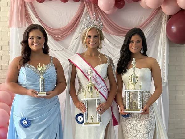 West Tennessee State Fair pageant queens with crowns, sashes, and trophies