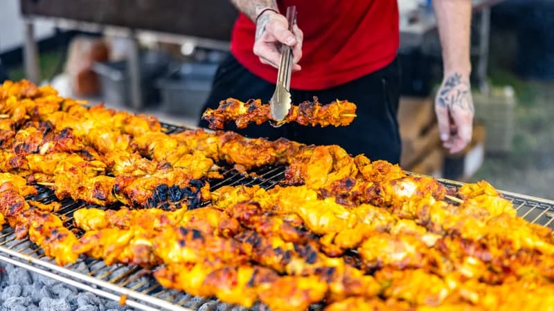 Grilled chicken on a food vendor grill at the West Tennessee State Fair
